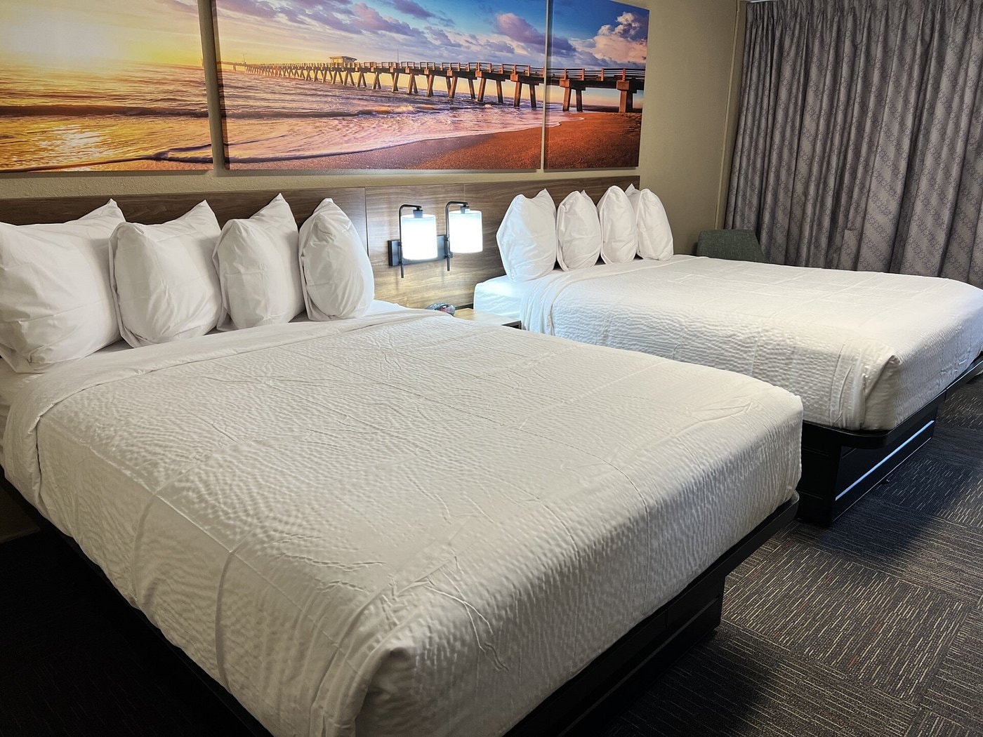 Double queen room at Days Inn Monroe — alternate angle showing TV and work desk